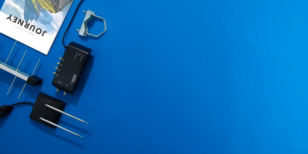 Blue background with antenna products laid out on left side