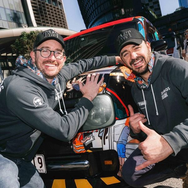 Two people from TIACS in Bunnings x TIACS hoodies