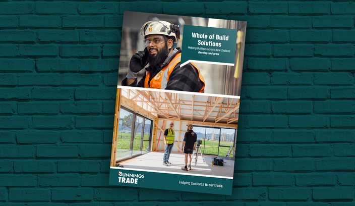 Whole of Build brochure on a Bunnings green brick background