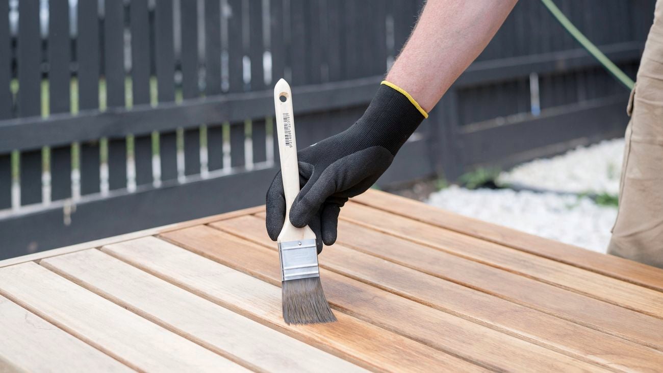 Using a paintbrush apply the furniture oil.
