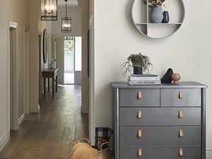 Hallway with storage cupboard , lights and mirror