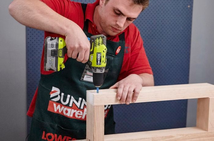 Person drilling pieces of timber together to be used for timber sofa lounge arm rests.
