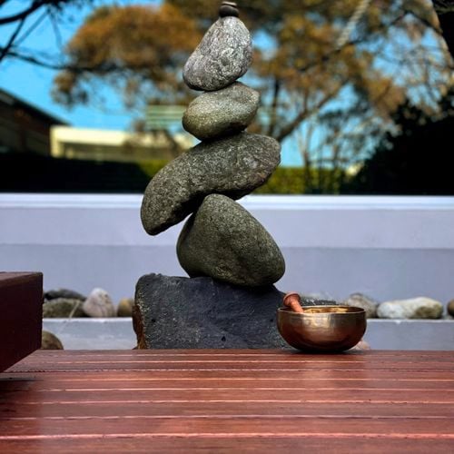 Stacked rocks near some decking.