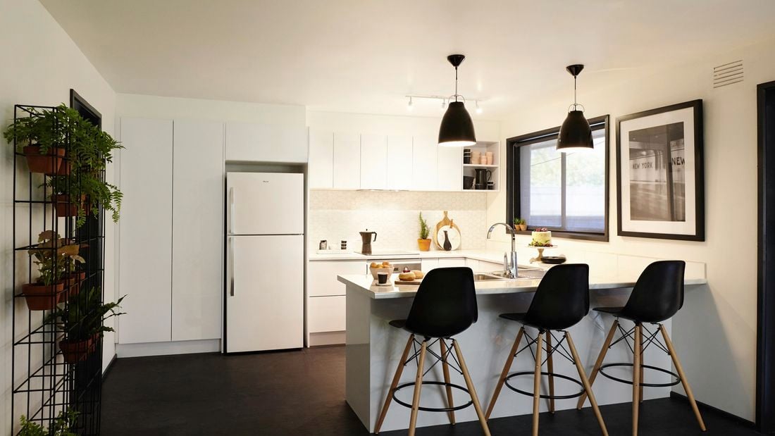 Renovated kitchen featuring a lot of white.