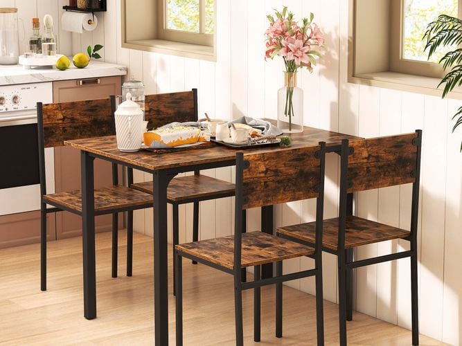 A brown dining set in a kitchen with an oven and dishwasher also in it.