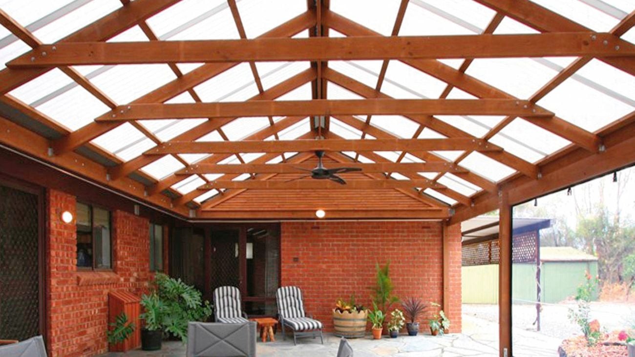 Large patio space outside a brick house.