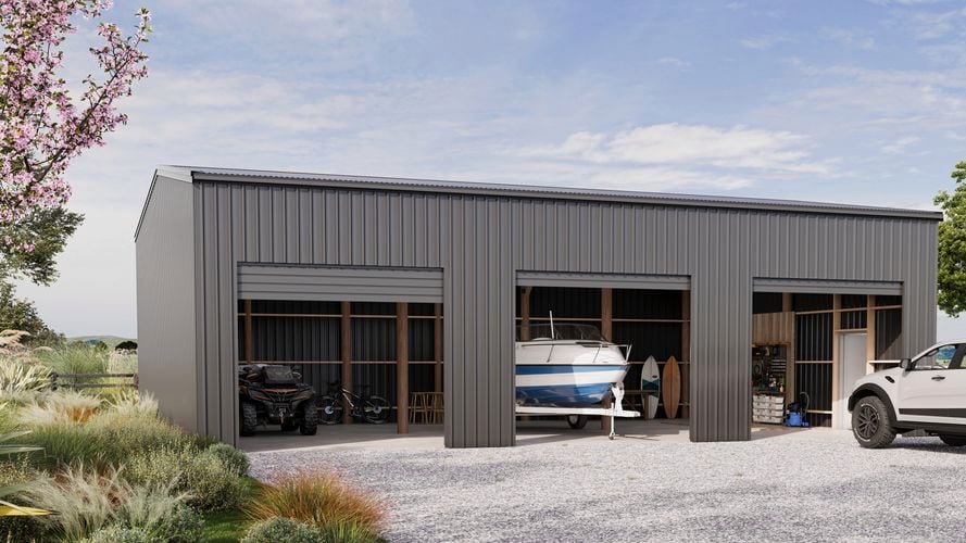 Large grey shed with boat, storage and side by side.