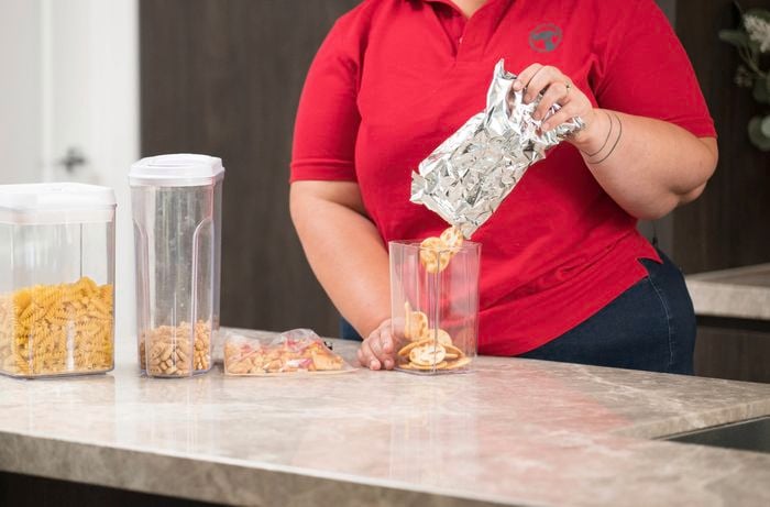dry goods cereal into an airtight container 