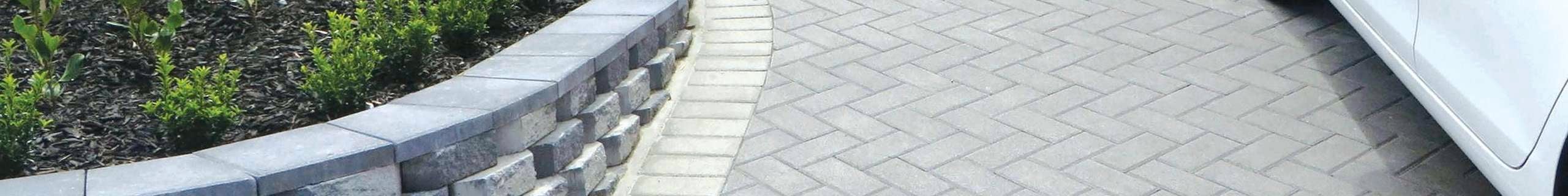 paved driveway with white car parked on it