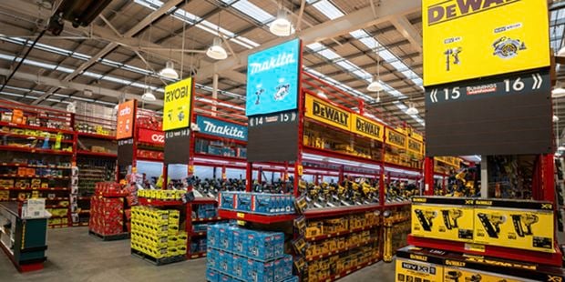    a {     text-decoration: none;     color: #464feb; } tr th, tr td {     border: 1px solid #e6e6e6; } tr th {     background-color: #f5f5f5; }     A wide view of toolshop with branded displays and shelves stocked with power tools and accessories.
