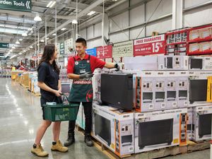 A customer and team member inside a Bunnings Store 