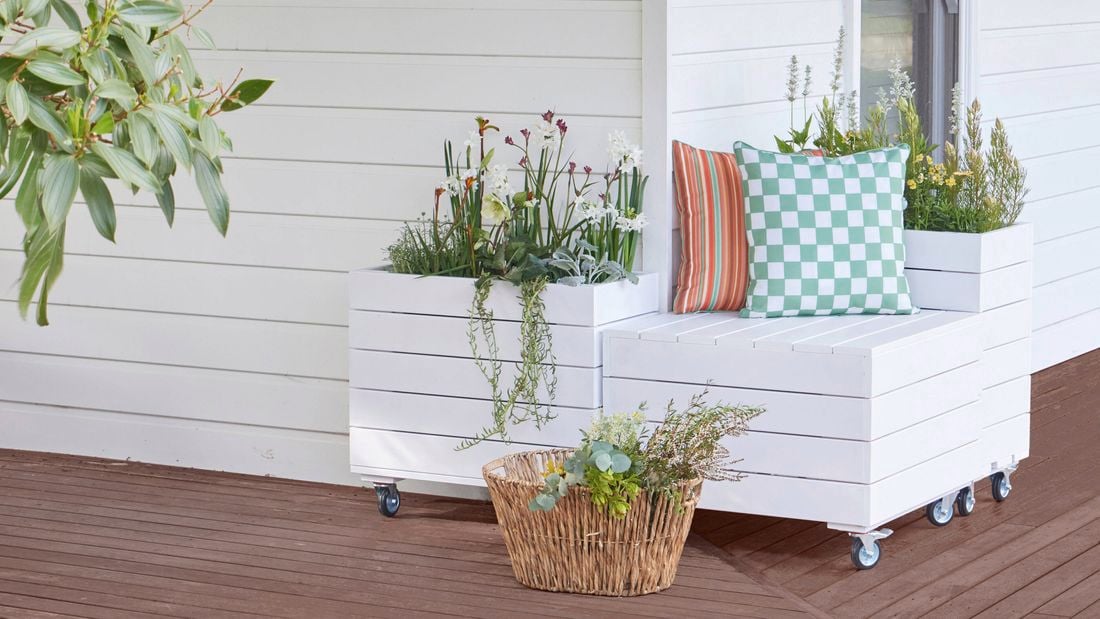 A planter bench photographed on a timber deck