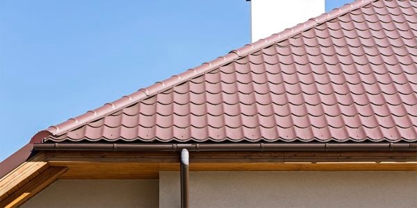 tiled roof with guttering and down pipe