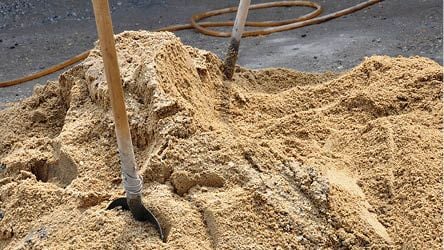 Pile of sand with shovel