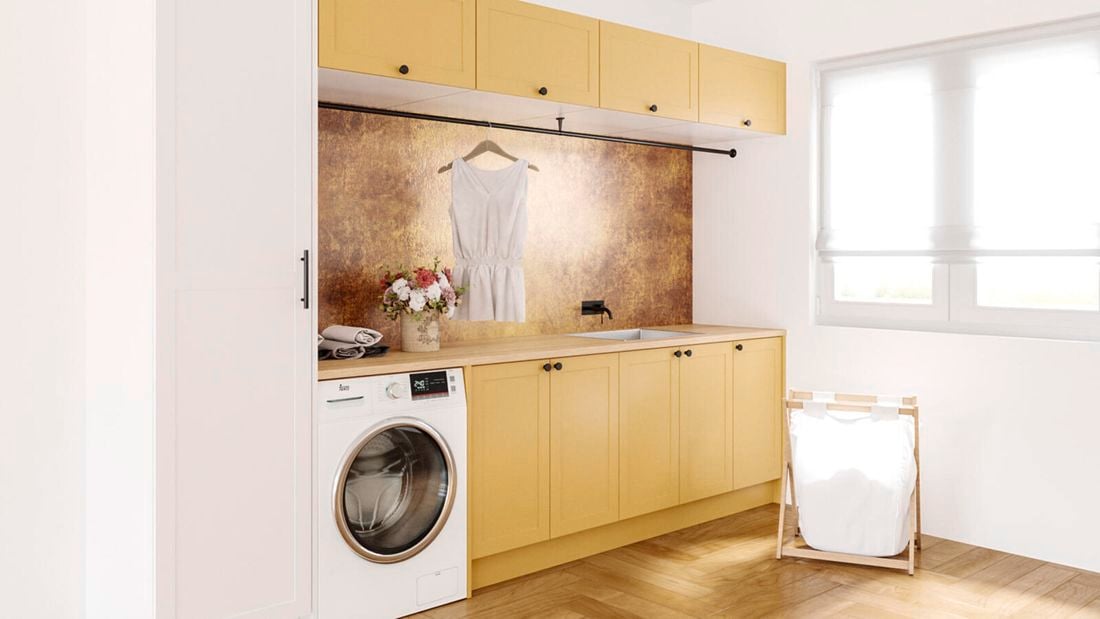 close up image with timber flooring, washing machine, overhead cupboards and washing hamper and white timber window