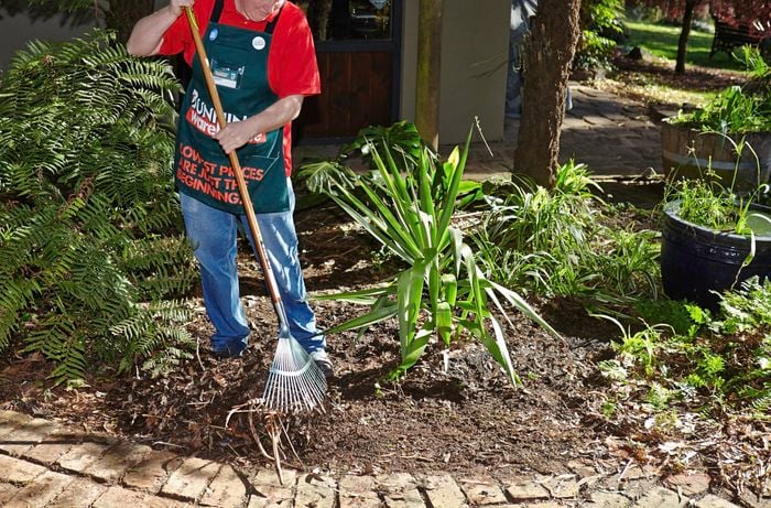 Person reducing ground cover.