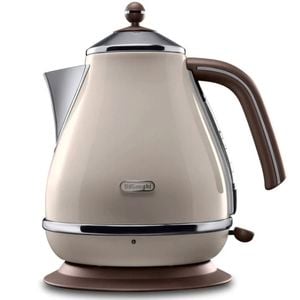 A Vintage cream kettle sitting on a hot plate.