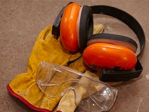 Ear muffs and safety gloves