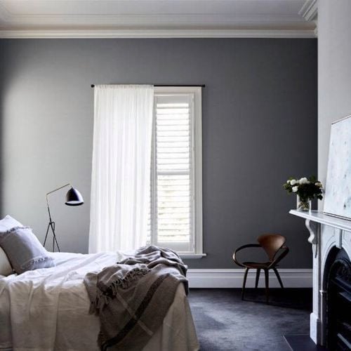 Styled bedroom with fireplace.