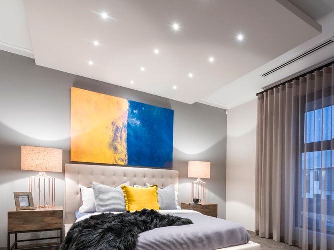 Bedroom with downlights lighting up the room 