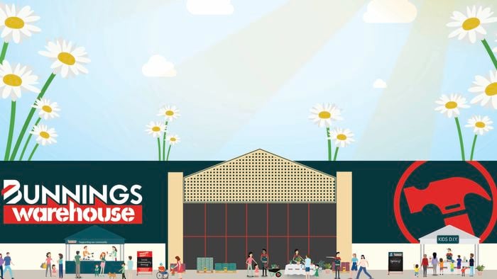 "Bunnings Warehouse storefront with signage and people outside under a sunny sky."