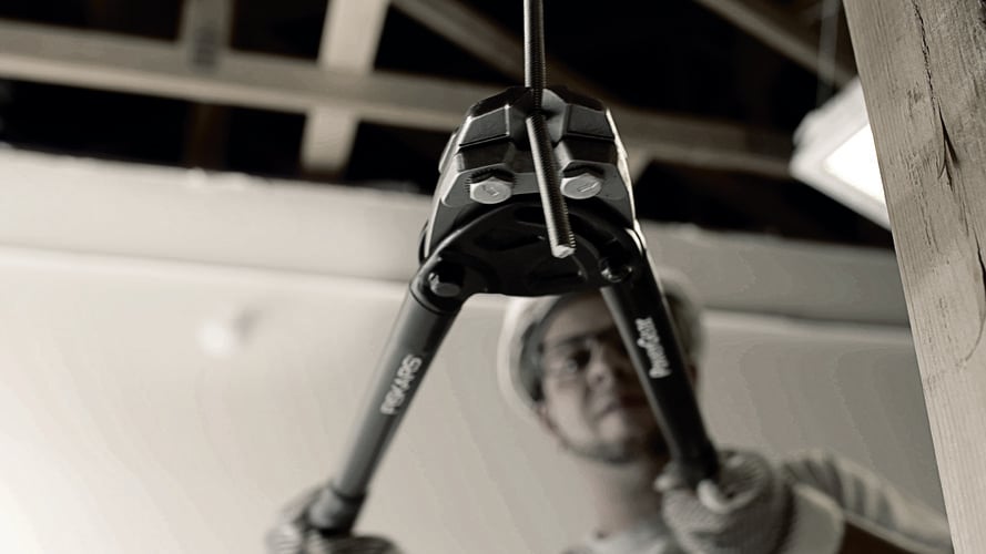 A bolt cutter being used to cut a bolt