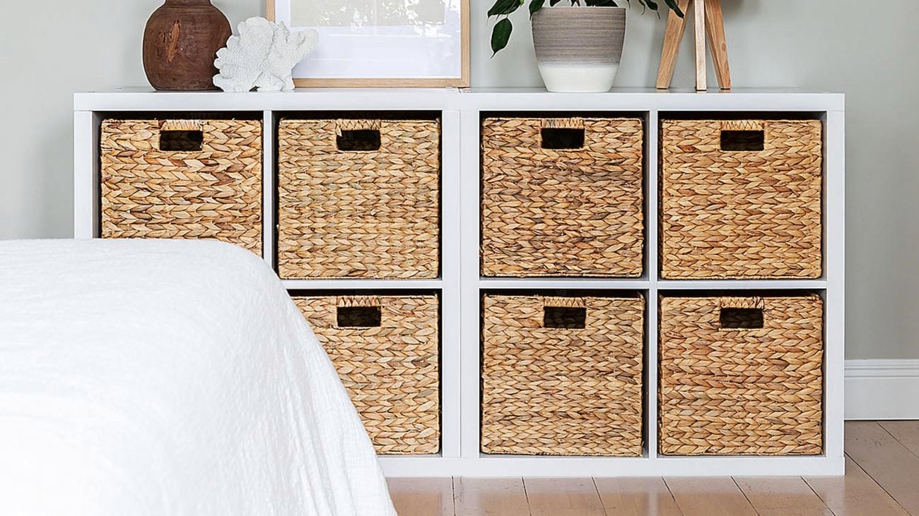 A cube storage unit in a bedroom.