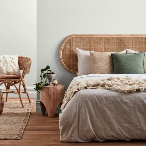 Bedroom styled with earthy themed furnishings.