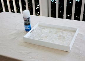A DIY tray with mosaic tiles after a sealer has been applied.