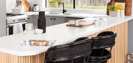 Kitchen bench with bar stools next to it