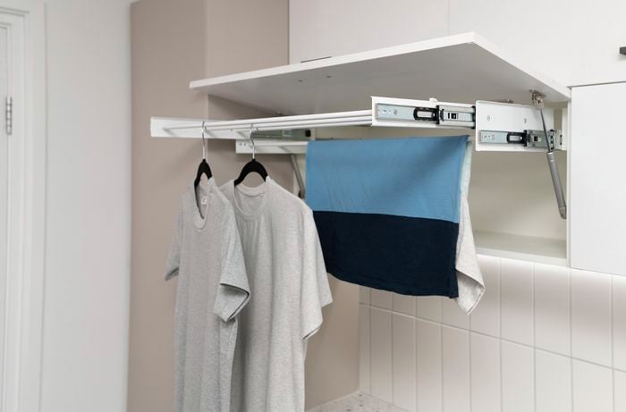 Cabinet with drying rack for clothes.