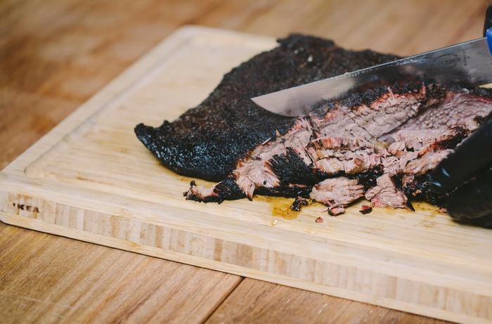 A finished brisket being sliced up