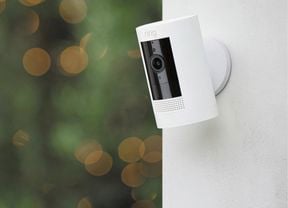 Ring security camera hung on a rendered wall 