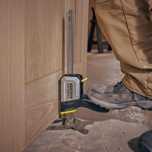 Stanley fat max being used to lift a cabinet