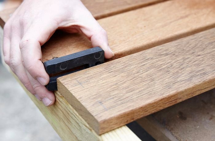 Person spacing timber apart.