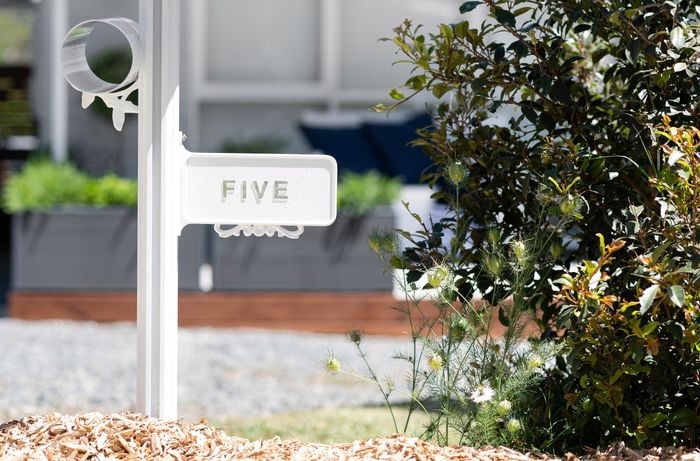 A finished letterbox with the number five