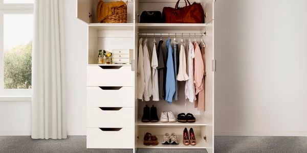 Bedroom storage with hanging clothes, shoes and bags.
