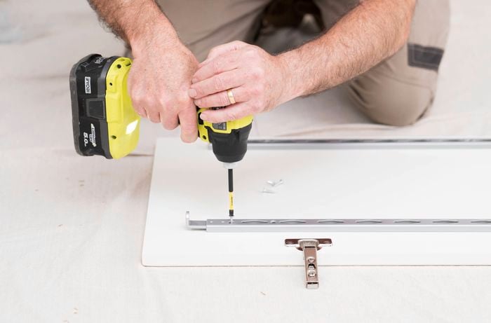 Prepare and attach the door rack