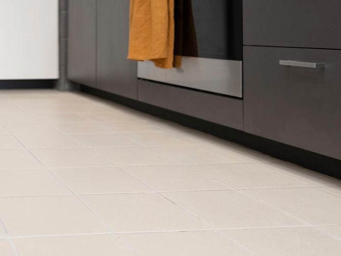 Light coloured tile kitchen needs grout cleaning.