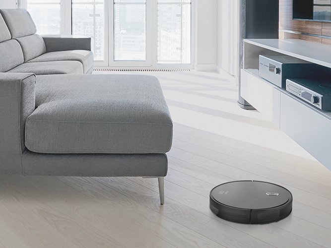 Smart robotic vacuum cleaner in lounge room.