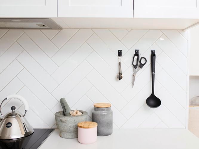 kitchen utensils on a wall