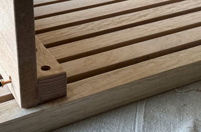 The legs being attached to the tabletop.