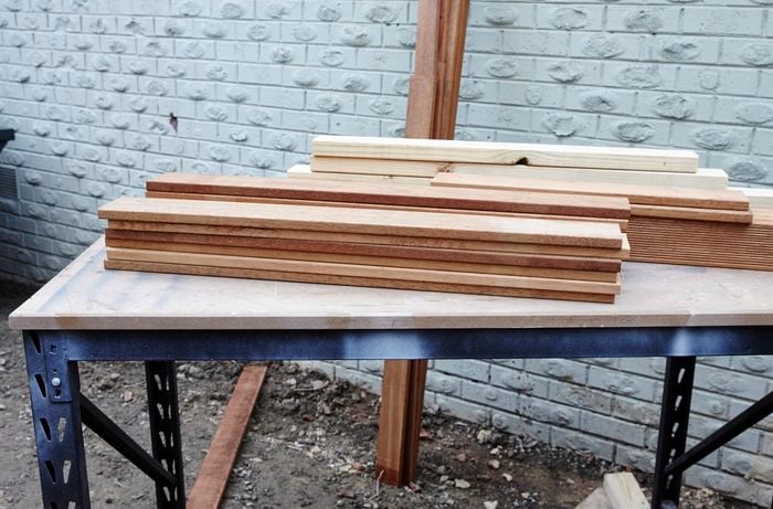 Timber laid out on a tabletop.