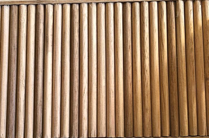 Timber dowels on side of herb planter.