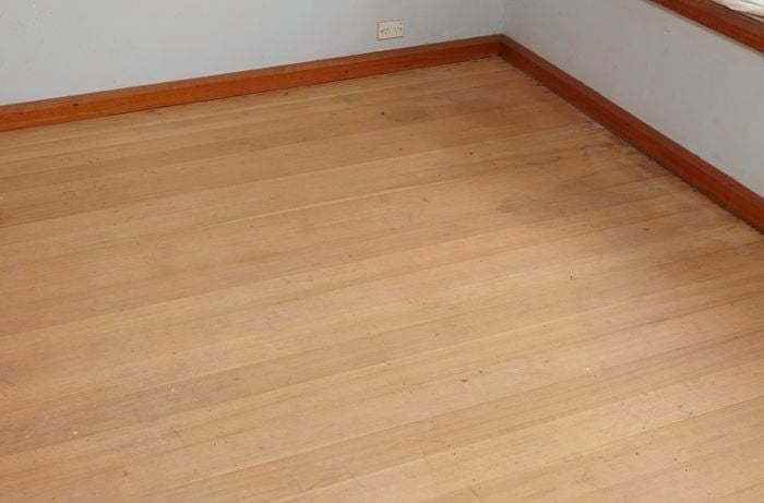A hardwood floor before being sanded
