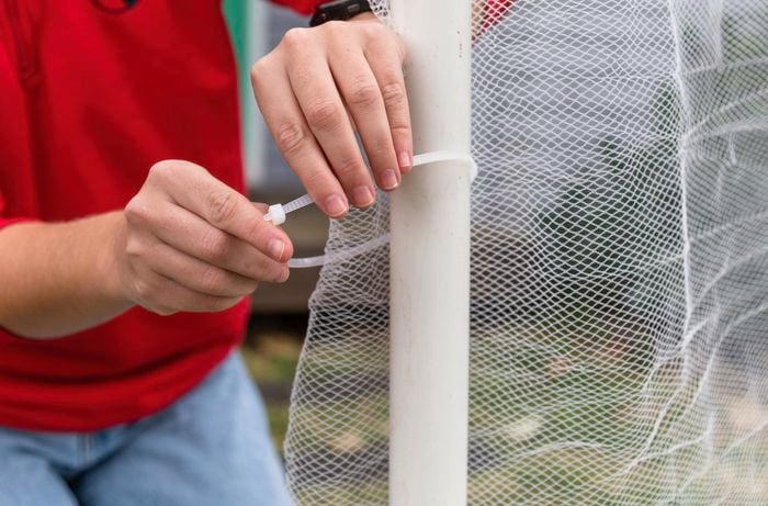 using cable ties to connect bird netting to pvc pipes