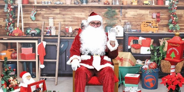 santa sitting in a store