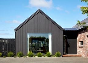 front of a house with brick work and cladding
