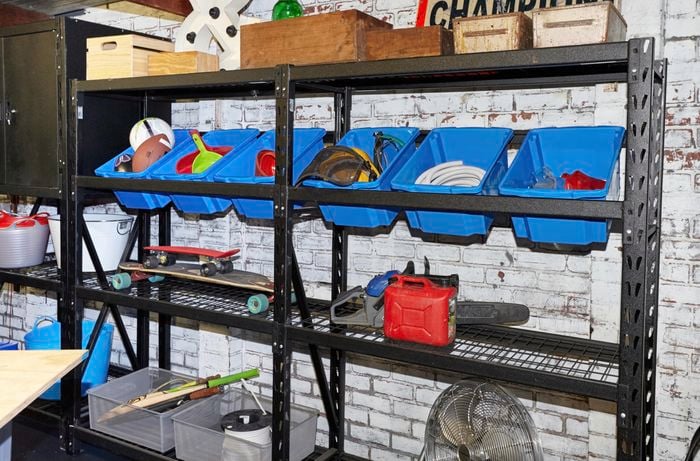 Garage shelves with assorted items on them.
