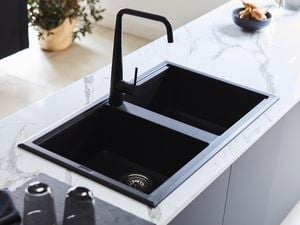 Black sink and tapware.